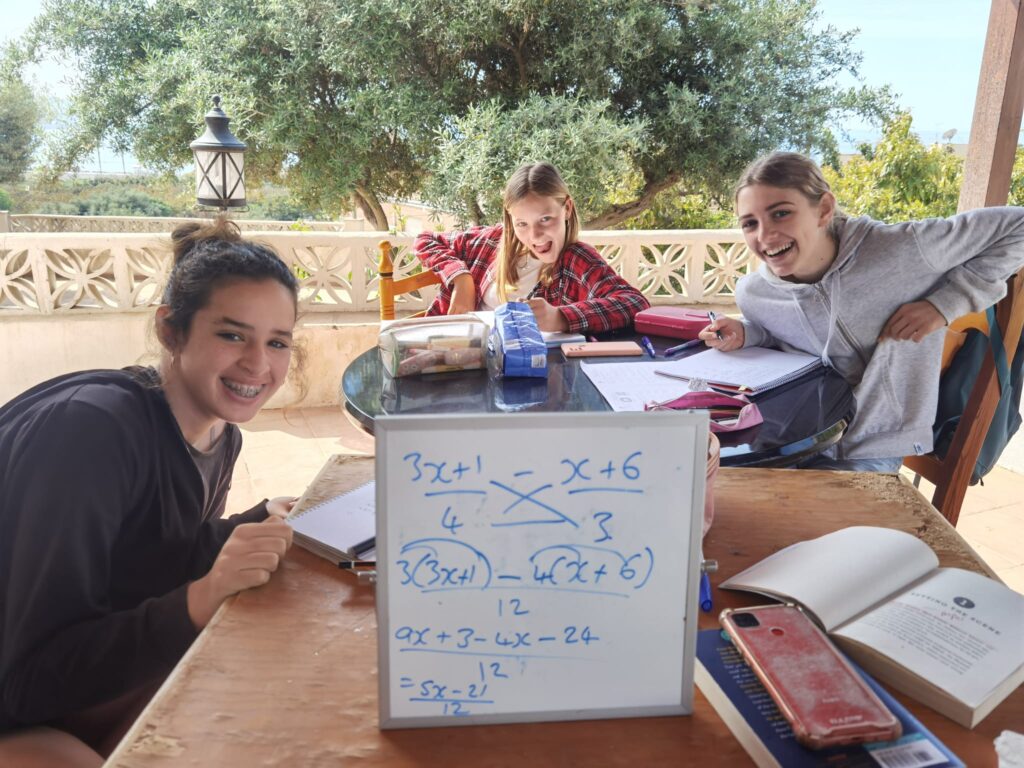 Teenage students in private maths tutoring session