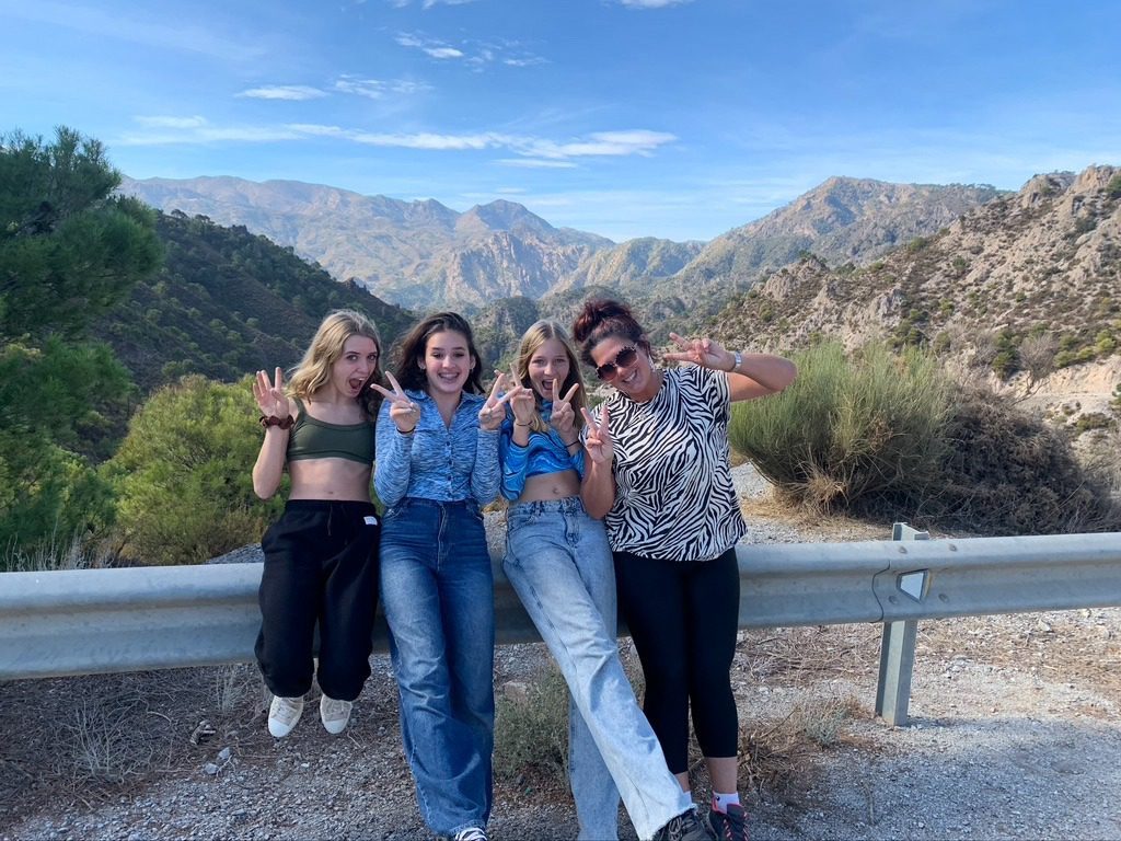 Teacher and students on mountain excursion
